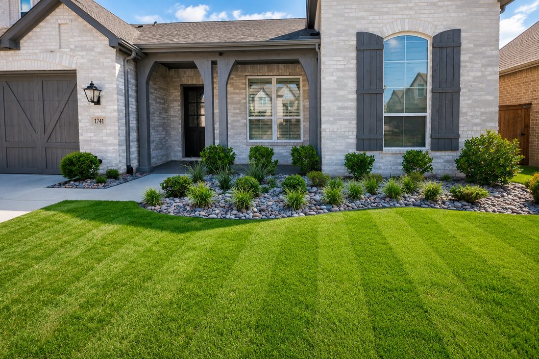 Completed front yard landscaping with lawn, edging and planter beds in Rockwall TX